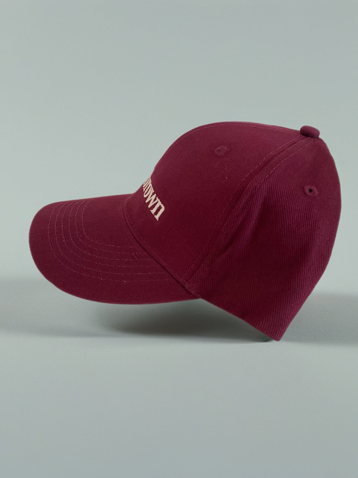 goldnbrown cap burgundy
